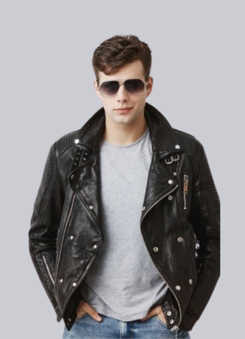 Young man in a black leather jacket and sunglasses, standing confidently with hands in pockets, against a gray background.