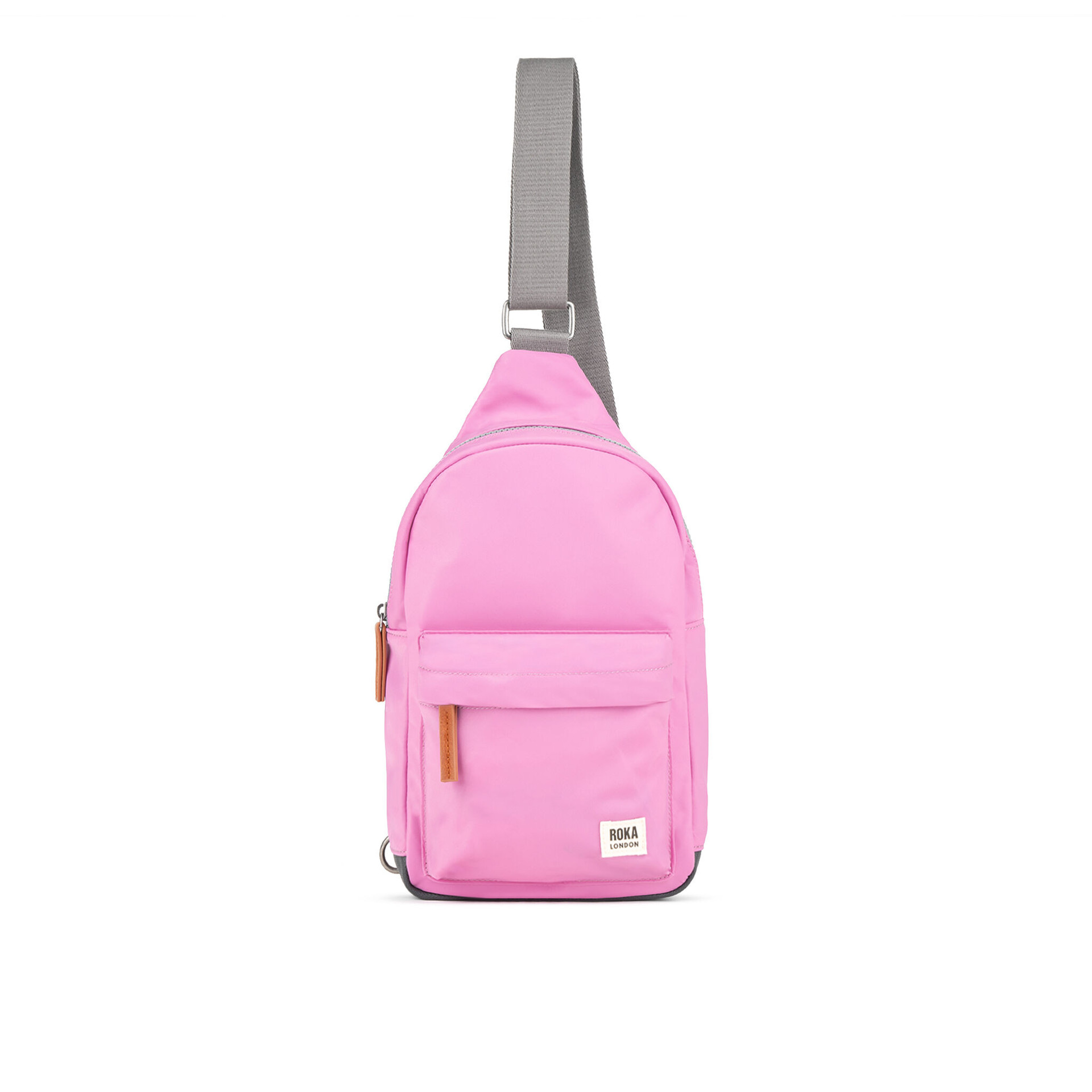 Pink sling backpack with a front pocket and gray strap, suitable for casual wear and travel.