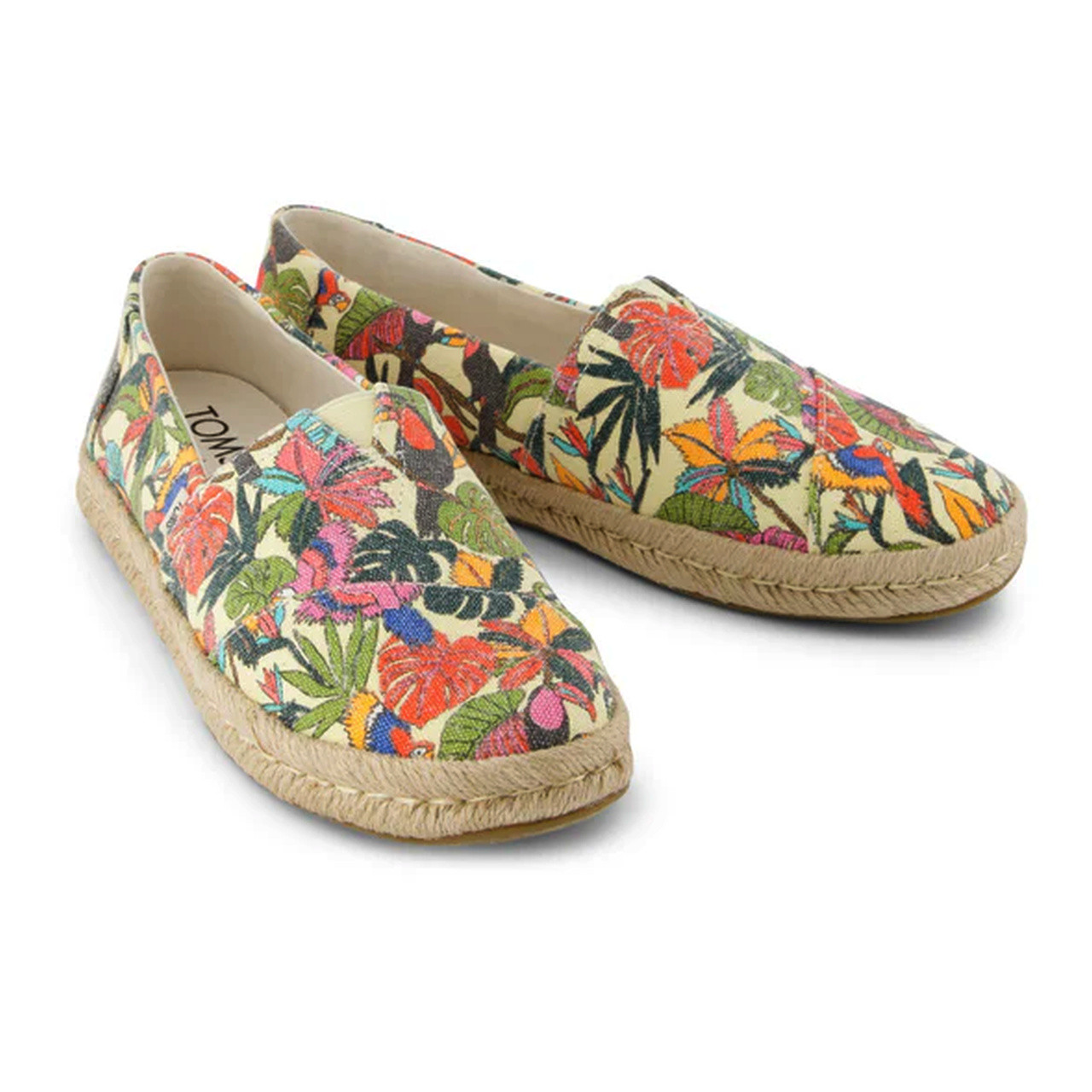 Colorful floral-patterned slip-on shoes with jute soles, perfect for casual summer style.